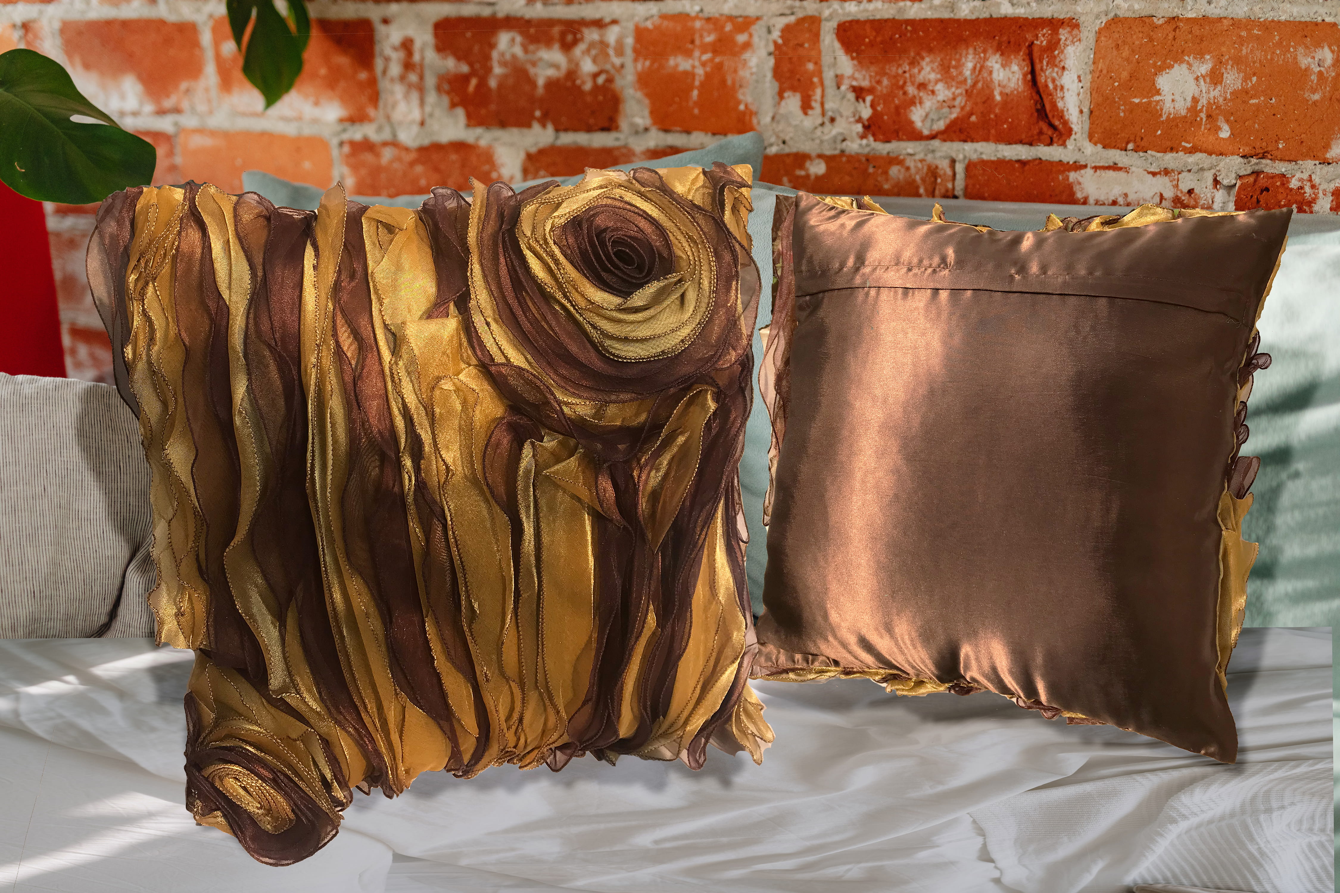 Gold brown 3D rose pillow paired in a warm caramel arrangement.